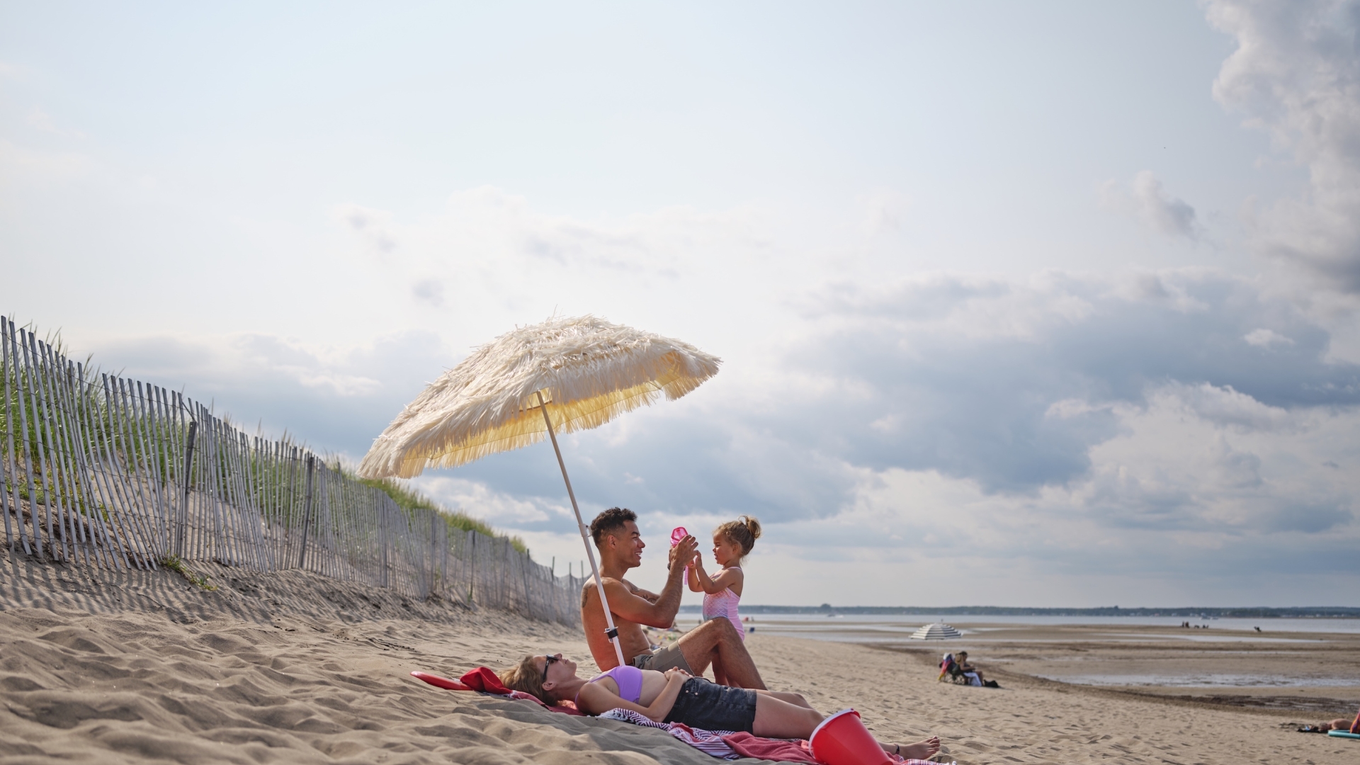 Family playing on the beach