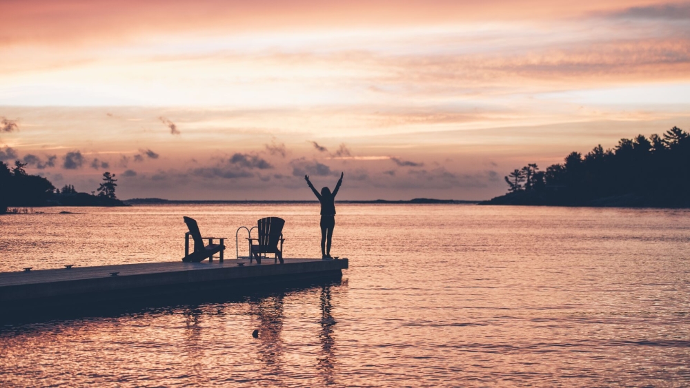 A person on the edge of a dock in Ontario, Canada